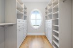 Walk in closet that serves the primary bedroom with plenty of storage space